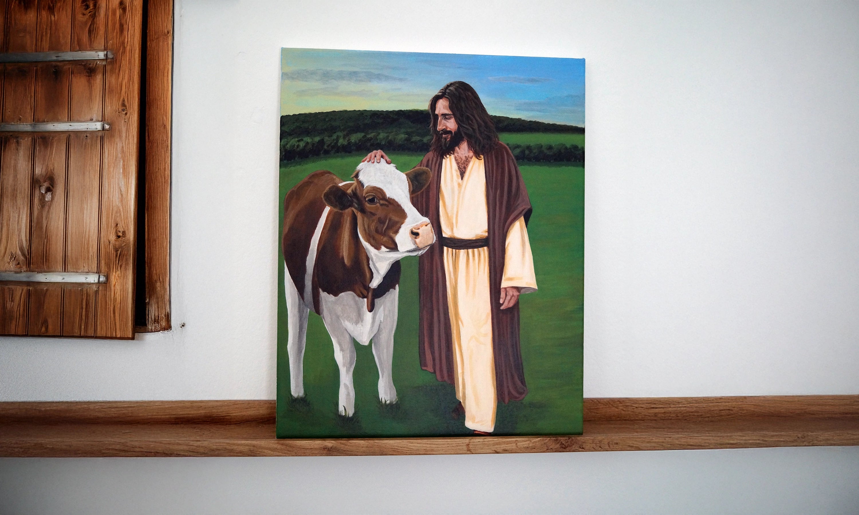 Jesus auf einer Weide mit einer Kuh.